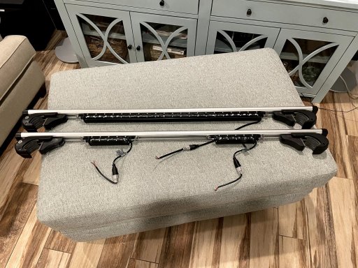 led bars mounted under roof rack cross bars.jpg