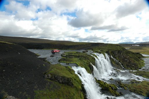 Waterfall River Crossing Iceland.jpg