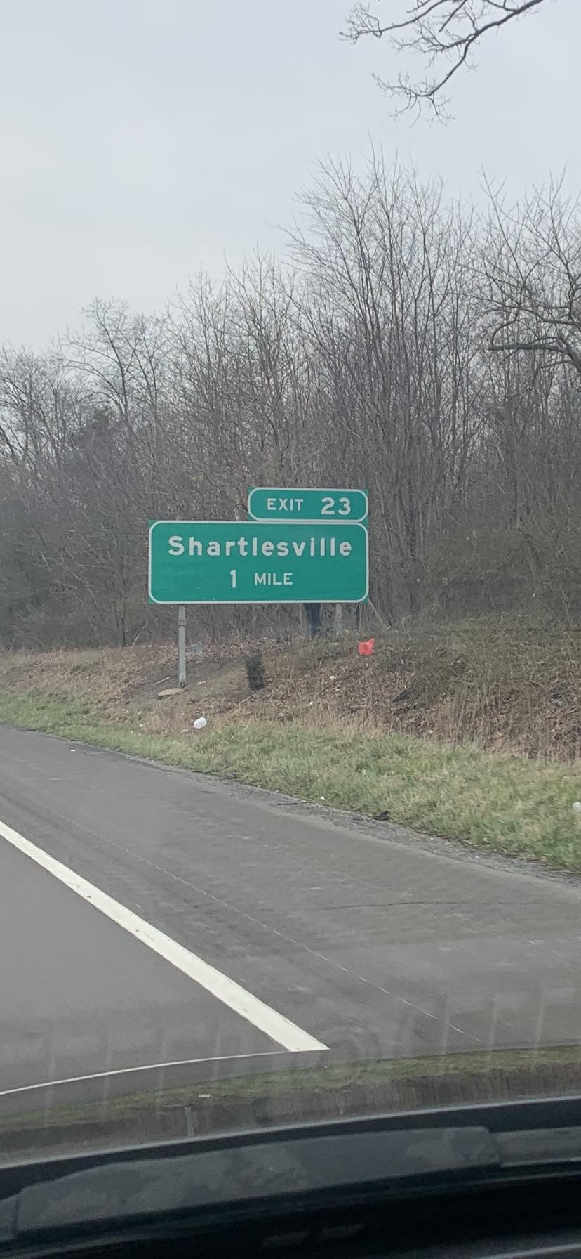 May be an image of road, tree and text that says 'EXIT 23 Shartlesville 1 MILE'